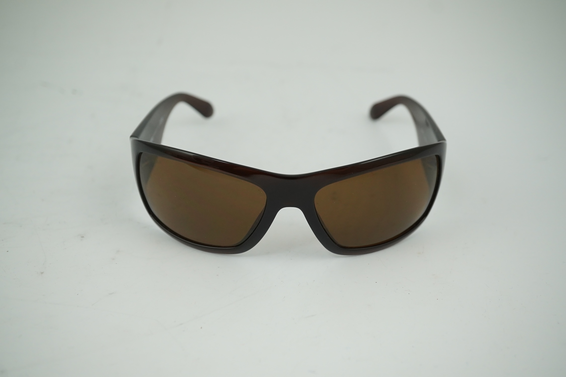 A pair of lady's brown Chanel sunglasses with hard case